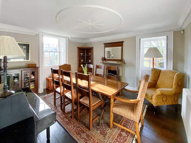 Dining room with piano and original open fire | Bradley Hall, Matlock