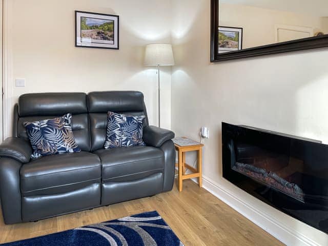 Contemporary wall mounted electric fire in living area | High Views, Keswick