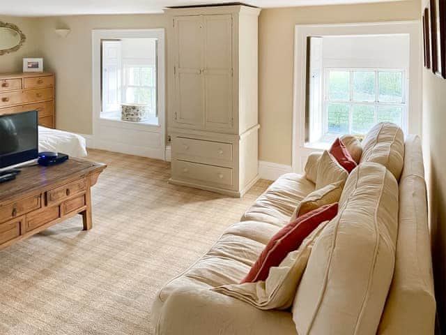 Master bedroom (2nd floor) with TV and sofa | Bradley Hall, Matlock
