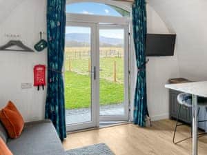 A glimpse of the scenic view from the living room of the bombie glamping pod | Bombie Glamping pod, Cromdale, near Grantown-on-Spey