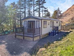 exterior and enclosed garden area | Katie&rsquo;s Cosy Caravan - Shepherds Holidays, Kilmallieu
