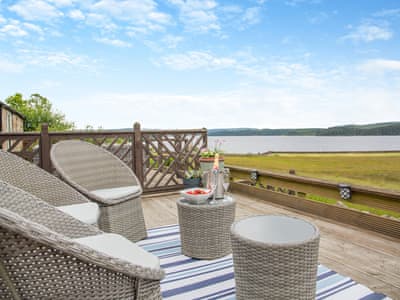 Decking area with seating and great views | Lake View Cottage, Yarrow Moor, near Bellingham