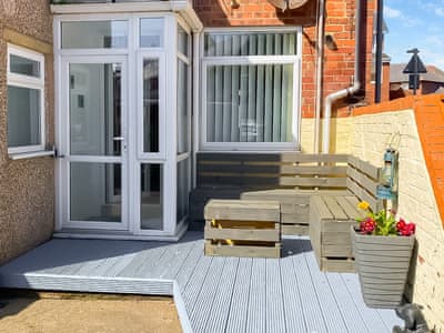 Holiday home with decked seating area | Seashells, Newbiggin-by-the-Sea, near Morpeth