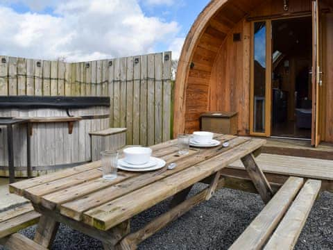 Decked terrace with outdoor furniture | Withy Bottom - Moorside Glamping Pods, Corney, near Millom