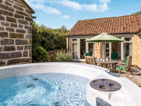 Patio area with hot tub | Willow Cottage, Harwood Dale, near Scarborough