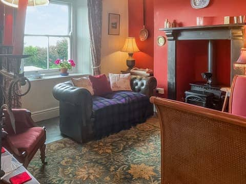 Cosy and comfortable living room with wood burner | Downhouse Cottage - Downhouse Cottages, Trebarwith, near Delabole