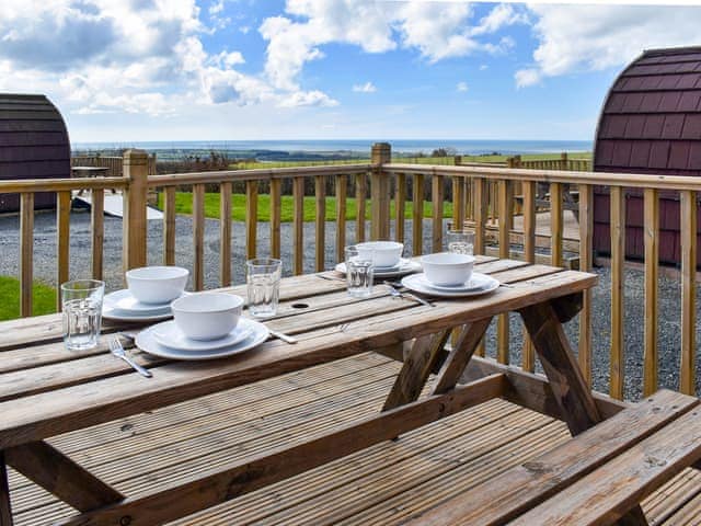 Decked terrace with outdoor furniture | Stainton - Moorside Glamping Pods, Corney, near Millom