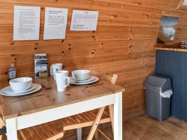 Intimate dining area and kitchen | Manx View - Moorside Glamping Pods, Corney, near Millom