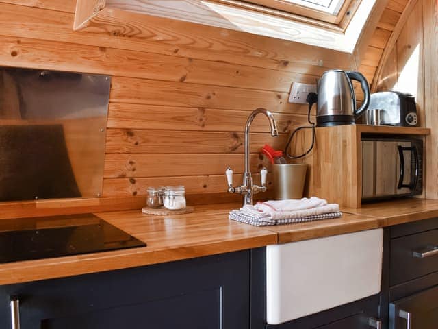 Intimate dining area and kitchen | Manx View - Moorside Glamping Pods, Corney, near Millom