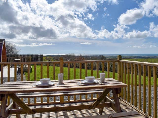 Decked terrace with outdoor furniture | Manx View - Moorside Glamping Pods, Corney, near Millom