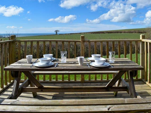 Decked terrace with outdoor furniture | Selker View - Moorside Glamping Pods, Corney, near Millom