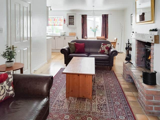 Comfortable living area and dining table and chairs | Erskine Cottage, Seahouses