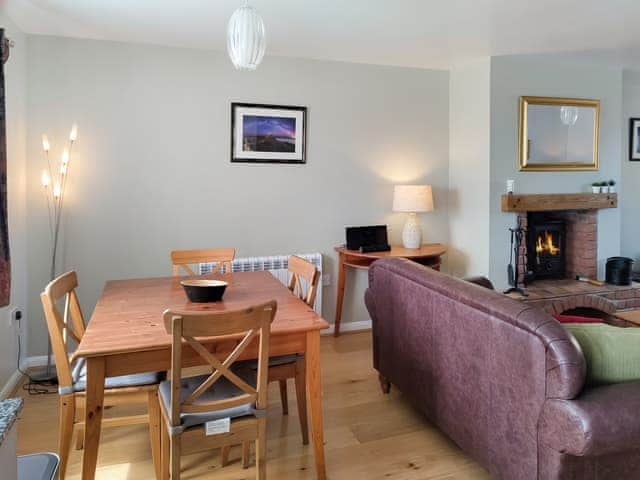 Comfortable living area and dining table and chairs | Erskine Cottage, Seahouses