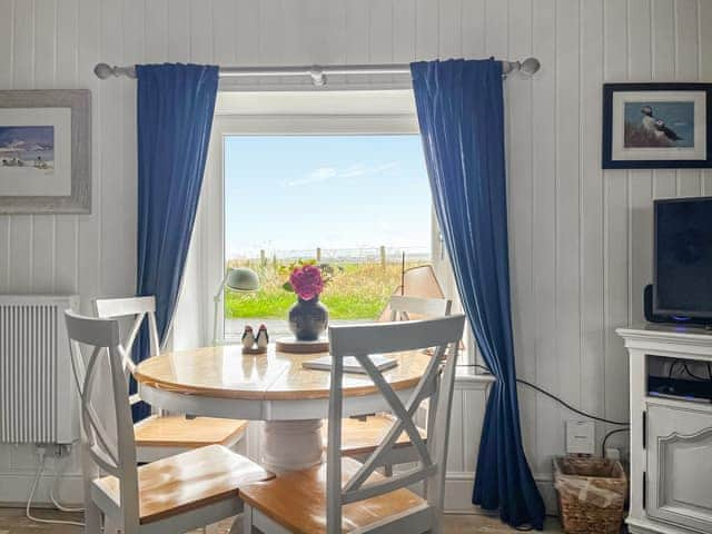 Modest dining area | Clutter Cottage, Druridge Bay