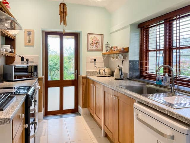 Bright, modern kitchen with gorgeous long distance views | The Headmaster&rsquo;s Cottage, South Hill, near Tamar Valley