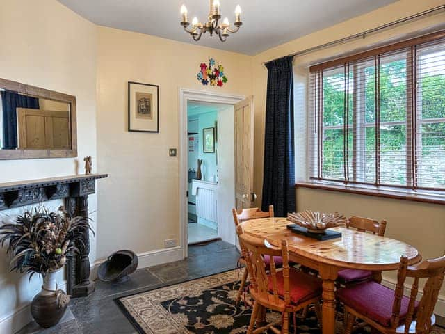 Spacious dining room adjacent to the kitchen, with original Delabole slate floor | The Headmaster&rsquo;s Cottage, South Hill, near Tamar Valley