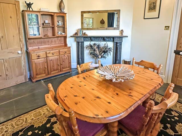 Dining room with a selection of board games, a book exchange, local maps and walk books and ideas on things to see and do | The Headmaster&rsquo;s Cottage, South Hill, near Tamar Valley