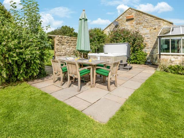 Attractive patio area within the garden | Mulberry Cottage, Harwood Dale, near Scarborough