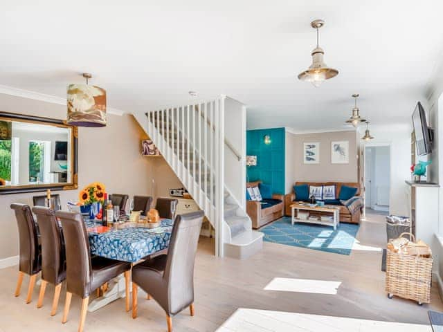 Enjoy family meals indoors or eat alfresco on the south facing rear deck with views | Tregarrek, Helston & The lizard