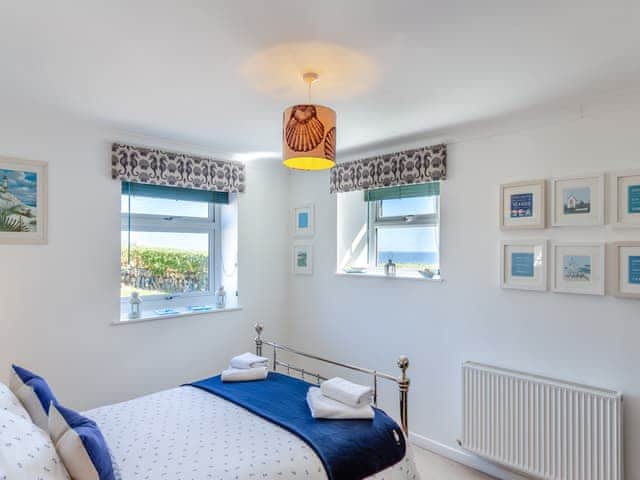 Dual aspect seaview kingsize ensuite with dressing area, comfy deep mattress and Seasalt bedding | Tregarrek, Helston & The lizard