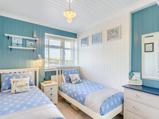 The cabin themed twin room at the front has a lovely whale rail for your hanging clothes | Tregarrek, Helston & The lizard