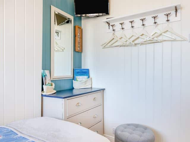 The cabin themed twin room at the front has a lovely whale rail for your hanging clothes | Tregarrek, Helston & The lizard