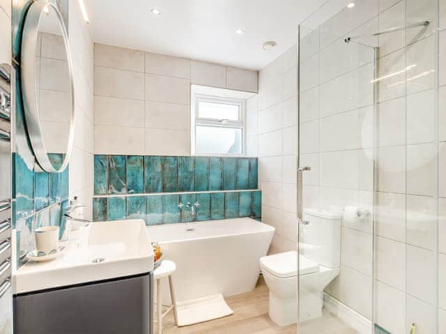 Main bathroom with freestanding bath and large walk in shower | Tregarrek, Helston & The lizard