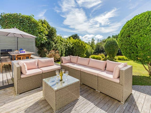 Step out of the dining area to your spacious rear deck overlooking the huge coastal private garden | Tregarrek, Helston & The lizard