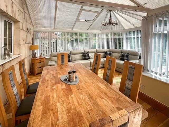 Dining area within the conservatory | West Fells Cottage, Rowrah, near Frizington