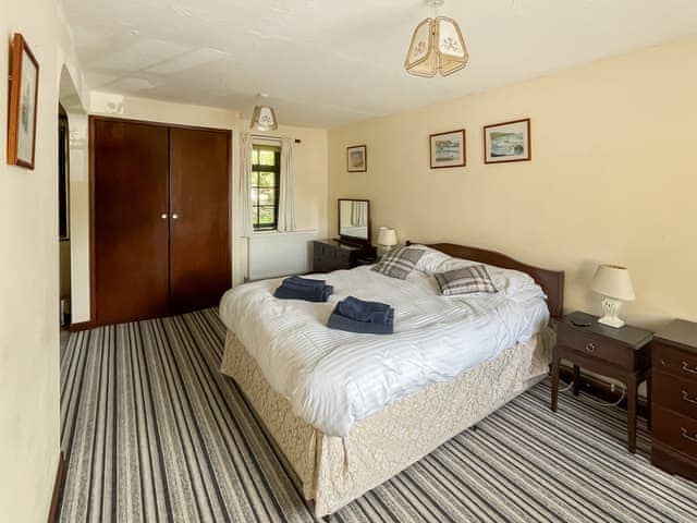 Ground floor double bedroom with en-suite | Mill Cottage - Trimstone Manor Cottages, Trimstone, near Woolacombe