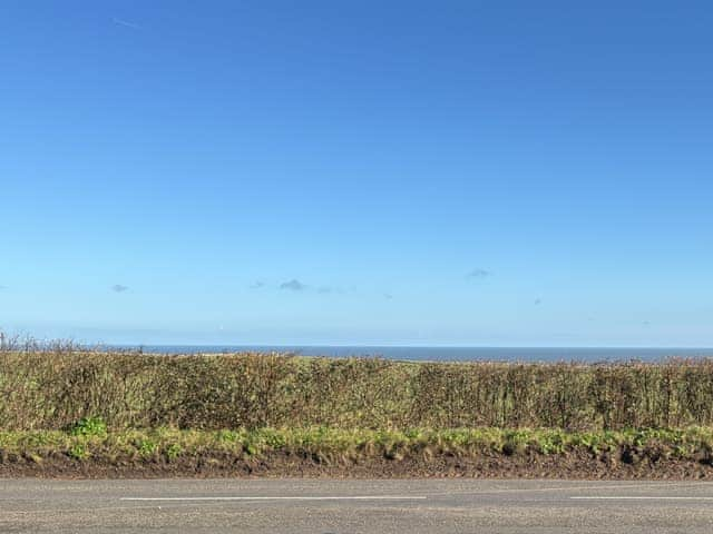 Set just a field back from the Beach, the large open gable windowed lounge, overlooks the beautiful views of the sea. Perfect for summer or winter, the views are amazing. | Seafields, Sidestrand