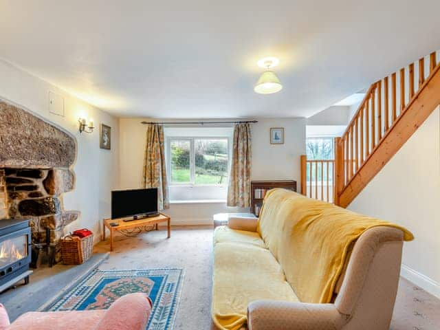 Cosy living room with wood burner | Lukesland Farm Cottage, Harford, Dartmoor National Park