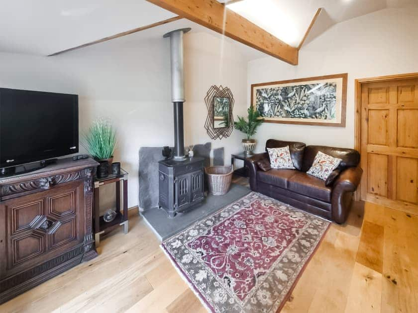 Cosy living room with access to the garden | Stonecroft Cottage - Wreaks End Farm, Broughton-in-Furness