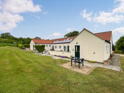 Paved Patio with Table & Chairs and Front Door | Roses Rest - Greetham Retreat, Greetham, near Horncastle