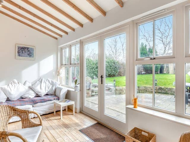 South facing garden room with French doors leading to the patio | Bumble Cottage, Newton-on-the-Moor, near Alnwick