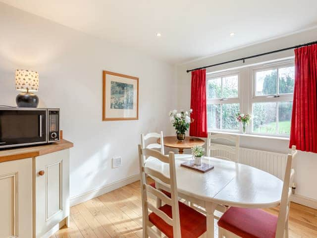 Convenient dining area adjacent to the kitchen | Bumble Cottage, Newton-on-the-Moor, near Alnwick