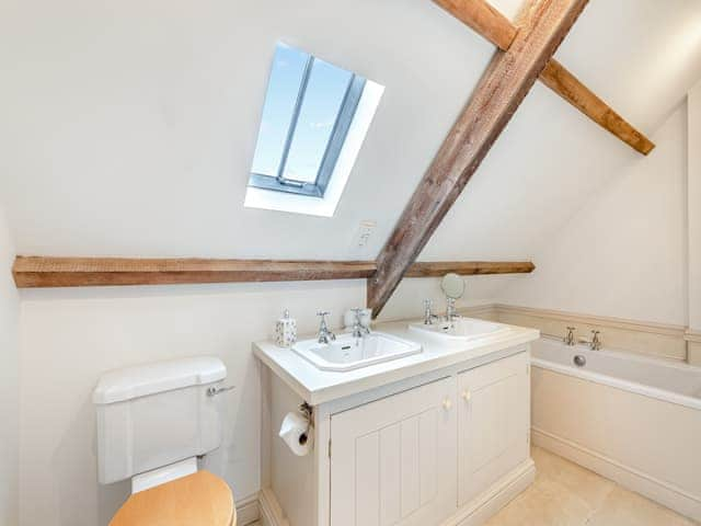 Bathroom with Jack and Jill wash basins,bath and large shower cubicle | Bumble Cottage, Newton-on-the-Moor, near Alnwick