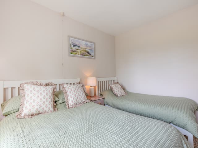 Twin bedroom with one double bed and one single bed | Osmore Orchard, Membury