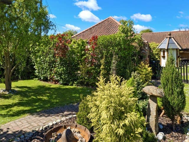 Mature gardens surround private courtyard. | Bockety Barn, Ingham, near Norwich