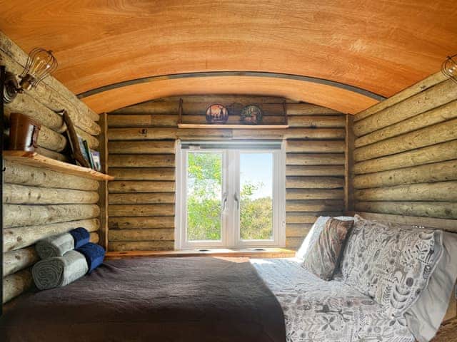 your bed with a view of the coast | Deer Close - Woodland Retreats, Millom