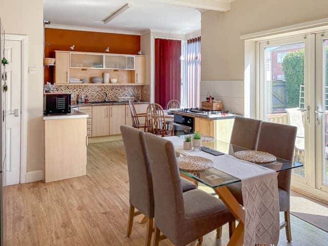 Kitchen opening on to the decking area and garden | Lilac Villa, Skegness