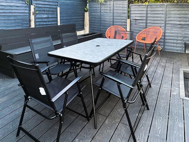 Multiple seating options in the secluded back garden | Morecambe Home Stays, Lancaster
