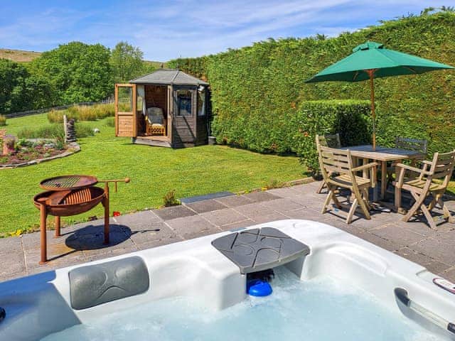 Back garden, hot tub and summer house | Dunstone Cottage, Cadover Bridge