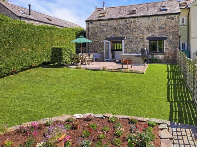 Garden and patio | Dunstone Cottage, Cadover Bridge