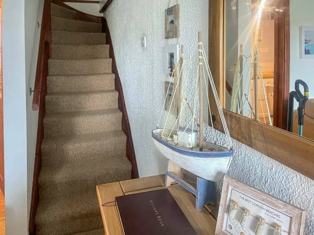 Stairs going out of comfortable Lounge area | Gribbas Cottage, Stithians