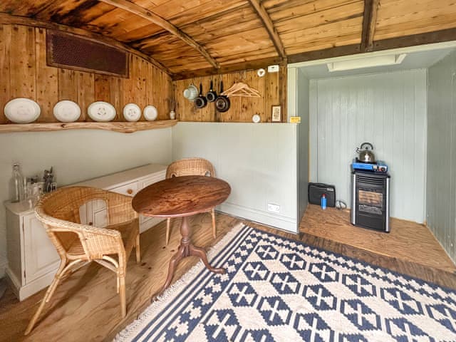 Kitchen/diner | Railway Carriage - Moat Farm Glamping, Shadowhurst, near Ashford