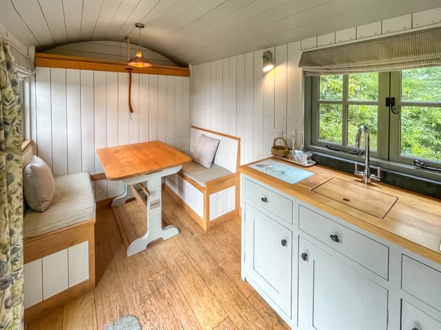 Kitchen/diner | Shepherds Hut - Moat Farm Glamping, Shadowhurst, near Ashford