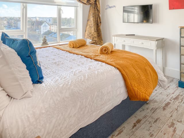 Relaxing comfortable king size bed with views of Big Wheel in Dreamland! | Fish N Ships, Margate