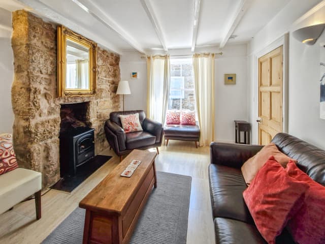 Contemporary decor sits comfortably alongside traditional furnishings | Oaken Cottage, Mousehole, Penzance