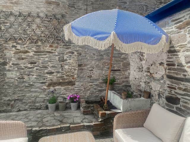 Striped blue and white summer umbrella and vegetable and herb patch | Le Grand Bleu, Aveton Gifford, near Bigbury-on-Sea and Challaborough